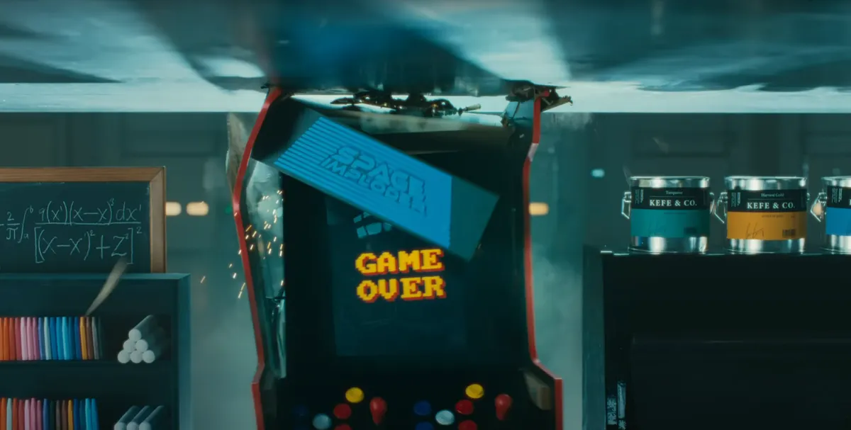 A screenshot from the Apple ‘Crush!’ iPad Pro video showing the point at which an arcade game buckles under the pressure of a